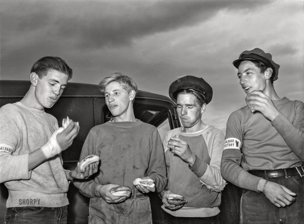 Photo showing: Junk, Food -- October 1942. Butte, Montana. Eating lunch at the scrap salvage campaign.