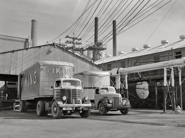 Photo showing: Big Mack -- October 1942. Tulsa, Oklahoma. Trucks being loaded with motor oil at the Mid-Continent refinery.