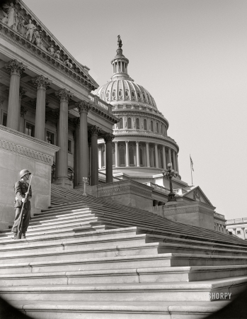 Photo showing: Wartime Washington -- Washington, D.C.,  circa 1942. U.S. Capitol, East Front. Sentry posted outside of House chamber.