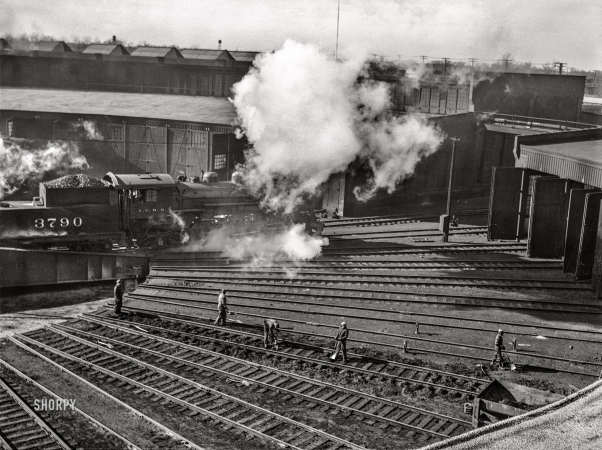 Photo showing: Trackwork -- November 1942. Chicago, Illinois. Maintenance crew
repairing roundhouse tracks at an Illinois Central Railroad yard.