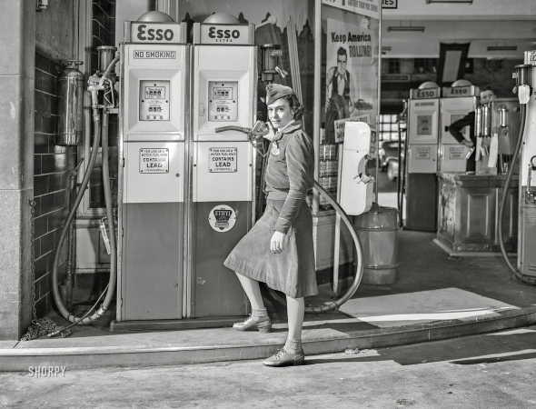 Photo showing: Esso Extra -- December 1942. New York, New York. Girl at gasoline pump.