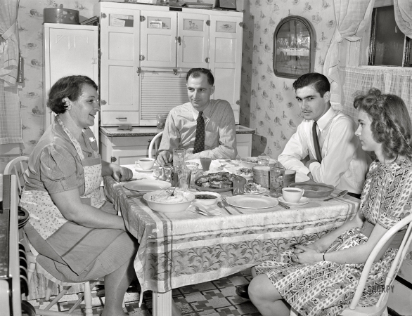 Photo showing: Lets Eat! -- November 1942. Pittsburgh Coal Company miner Andy Piatnik and family at home.