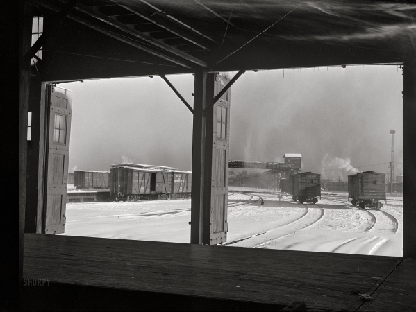 Photo showing: Frosty Freight -- December 1942. Chicago, Illinois. Looking out toward the icehouse
from the freighthouse at a yard of the Chicago and North Western Railroad.