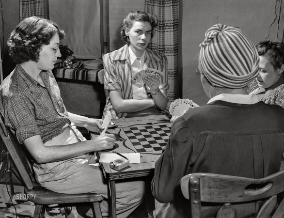 Photo showing: Play It as It Lays -- January 1943. Penasco, New Mexico. Marjorie Mueller, nurse at the Taos County clinic, playing bridge.
