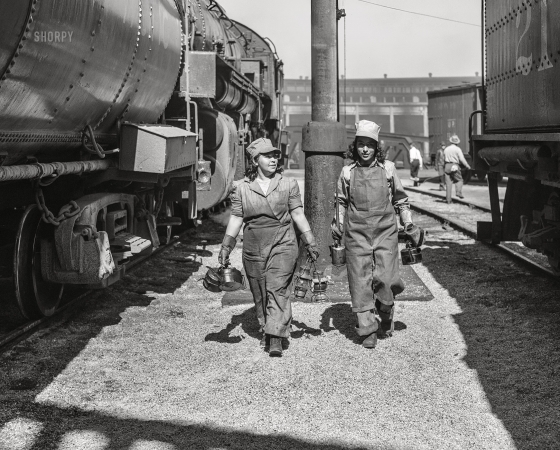 Photo showing: Trini and Molly -- March 1943. San Bernardino, California. Trinidad Gutierrez and Molly Alcanto, 'suppliers' who work at the Santa Fe roundhouse.