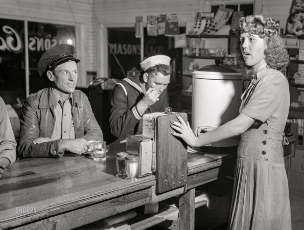 Photo showing: Masons Cafe -- March 1943. Truck driver and sailor at a coffee shop on U.S. Highway 90 in southern Louisiana.
