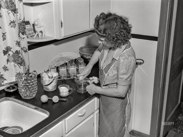 Photo showing: Appalachian  Lemonade -- May 1943. Point Pleasant, West Virginia. Mrs. Ferguson making lemonade.