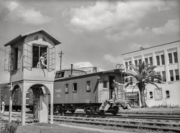Photo showing: The Woman in the Window -- May 1943. Beaumont, Texas. Lady who operates block signals for railroad crossing.