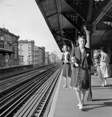 Photo showing: Cautious Commuter -- September 1942. New York, New York. Waiting for the Third Avenue elevated railway at East 89th Street about 8:45 a.m.