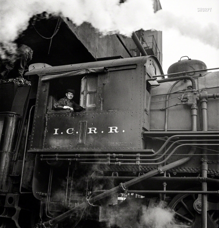 Photo showing: Illinois Central -- November 1942. Chicago, Illinois. Engine taking on coal at an Illinois Central Railroad yard.