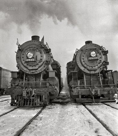 Photo showing: Goliath and Goliath -- December 1942. Locomotives in the Chicago and North Western departure yard about to leave for Clinton, Iowa.