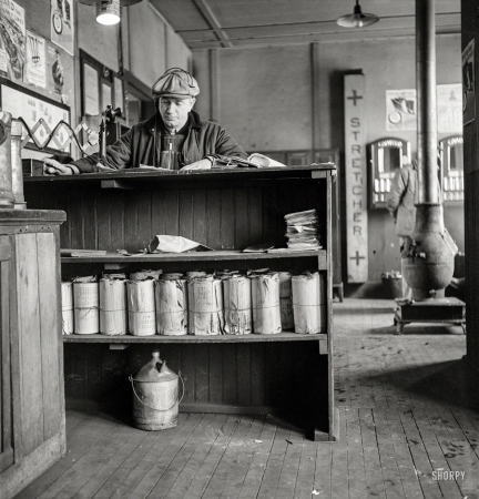 Photo showing: Conductor Cunningham -- January 1943. Freight operations on the Indiana Harbor Belt railroad.
Getting his waybills, Conductor Cunningham telephones his yardmaster.