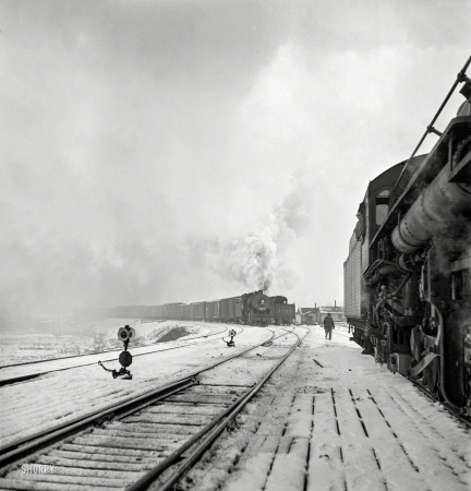 Photo showing: Snow Belt -- January 1943. Freight operations on the Indiana Harbor Belt railroad between Chicago
and Hammond, Indiana. The train pulls out of the Chicago & North Western yard.