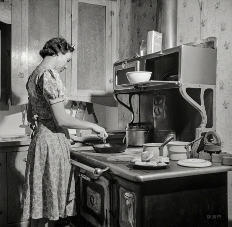 Photo showing: Heck Ranch -- February 1943. Moreno Valley, New Mexico. William Heck Ranch. Mrs. Heck getting supper.