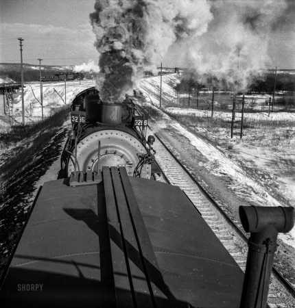 Photo showing: Tailgater -- March 1943. Chillicothe, Illinois. A helper engine is taken on for added power
on a grade between Chillicothe, Illinois, and Fort Madison, Iowa.
