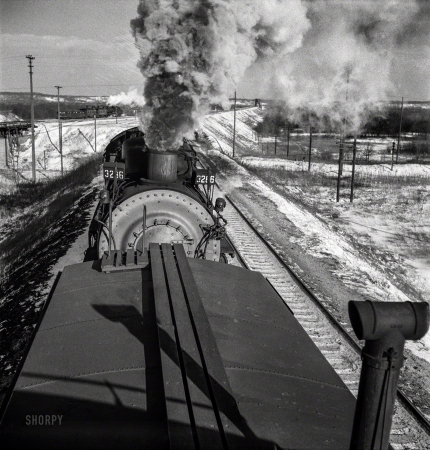 Photo showing: Tailgater -- March 1943. Chillicothe, Illinois. A helper engine is taken on for added power
on a grade between Chillicothe, Illinois, and Fort Madison, Iowa.