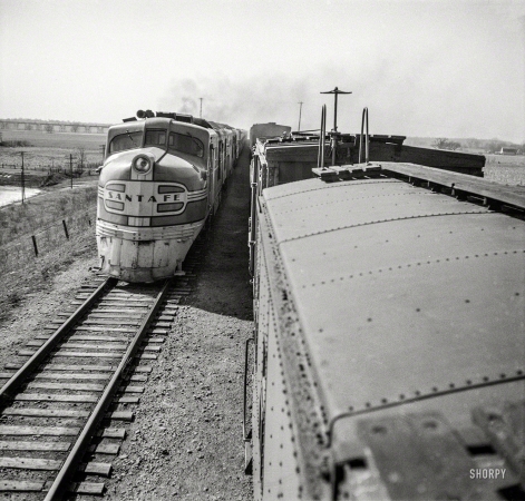 Photo showing: Electro-Motive -- March 1943. Sibley, Missouri. Passing one of the diesel passenger locomotives of the Atchison, Topeka and Santa Fe.