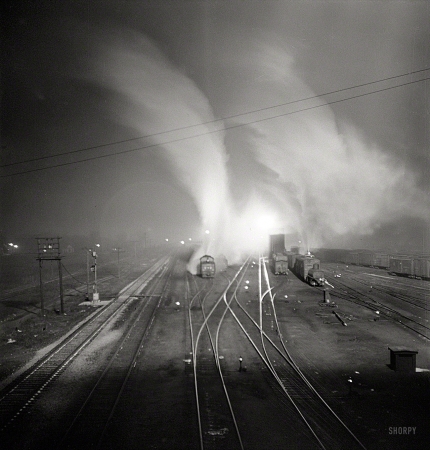 Photo showing: Heart of Darkness -- March 1943. Argentine, Kansas. Freight train about to leave the Santa Fe rail yard for the West Coast.