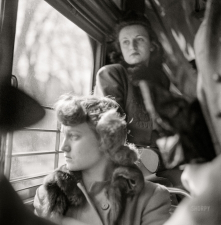 Photo showing: Here We Go Again -- March 1943. Washington, D.C. Riding on a streetcar.
