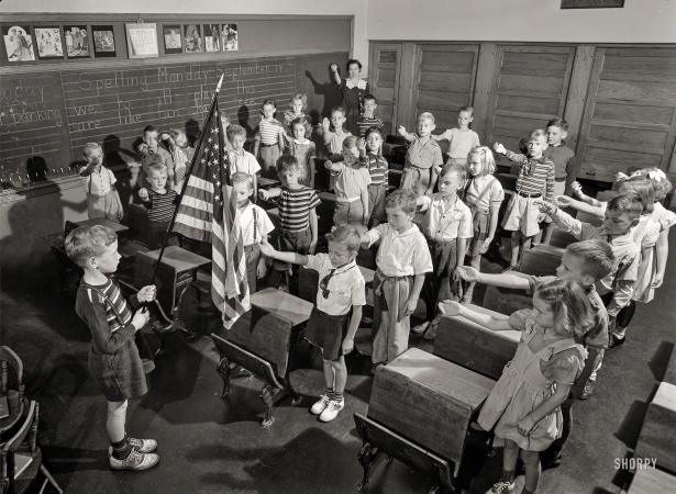 Photo showing: A Patriotic Gesture -- September 1942. Rochester, New York. Earl Babcock's school day begins with the salute to the flag.