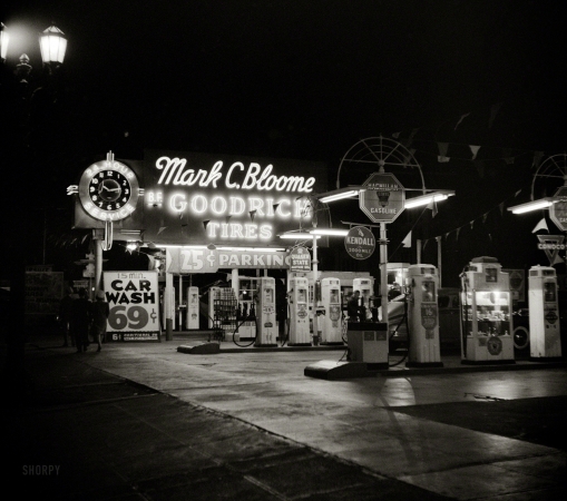 Photo showing: Fill Noir -- April 1942. Hollywood, California. Gasoline filling station at night.