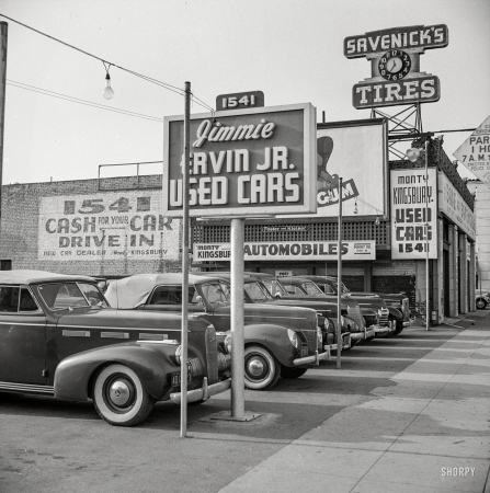 Photo showing: Cash for Your Car -- April 1942. Hollywood, California. Used car lot.