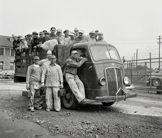Photo showing: Color Wheels -- May 1943. Bethlehem-Fairfield shipyards, Baltimore. Ship painters loaded on a truck.