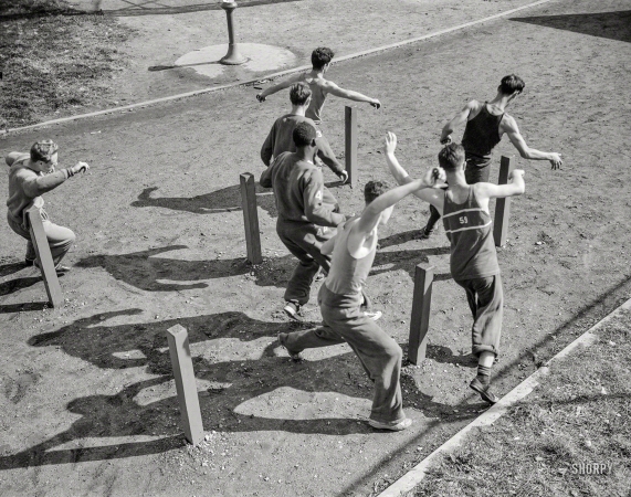 Photo showing: As Boys Grow -- October 1942. Benjamin Franklin High School, New York. Victory Corps.
High school boys growing physically fit through exercise.