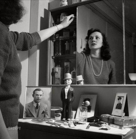 Photo showing: Lotion Locker -- June 1943. Arlington, Virginia. Mirrors over the dressing table conceal
a cabinet which gives girls extra space for their cosmetics, etc.