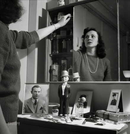 Photo showing: Lotion Locker -- June 1943. Arlington, Virginia. Mirrors over the dressing table conceal
a cabinet which gives girls extra space for their cosmetics, etc.