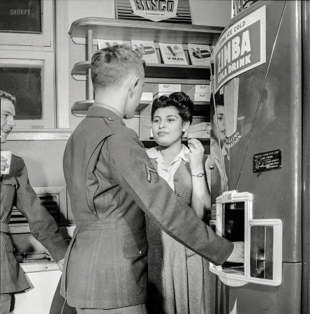 Photo showing: Bingo Zimba -- June 1943. Arlington, Va. Soldier treating his date to
a coke in the service shop at Idaho Hall, Arlington Farms.