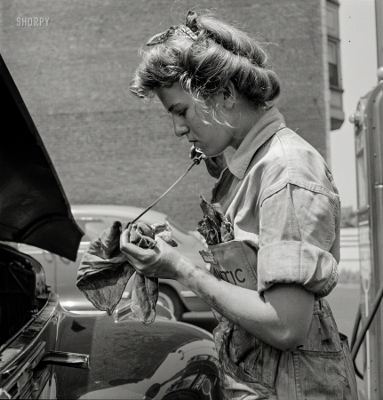 Photo showing: Well Oiled -- June 1943. Philadelphia. Miss Natalie O'Donald, attendant at the Atlantic Refining Co. garages.