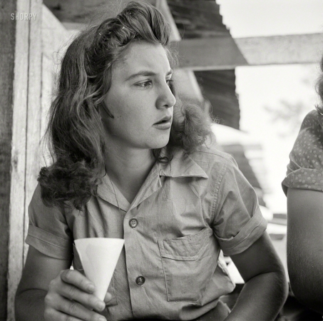 Photo showing: Sawdust in Her Hair -- June 1943. Turkey Pond, near Concord, New Hampshire. Women workers employed
by a Department of Agriculture timber salvage sawmill. 18-year-old 'pit-woman' Norma Webber.