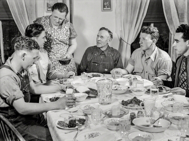 Photo showing: Farm Table -- July 1943. Rockville, Maryland (vicinity). Private Harvey Horton, visiting the N.C. Stiles
dairy farm while on furlough from Fort Belvoir, Virginia, at dinner with the family.