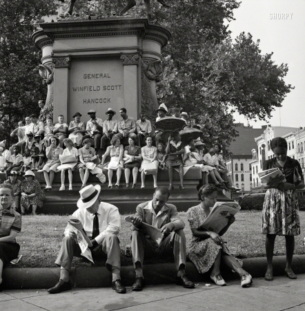 Photo showing: Wait, Watchers -- July 1943. Washington, D.C. Waiting for the parade to recruit civilian defense volunteers.