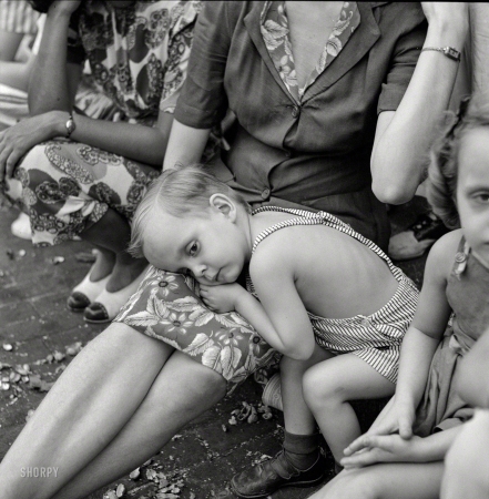 Photo showing: Parade Rest. -- July 1943. Washington, D.C. Spectators at the parade to recruit civilian defense volunteers.