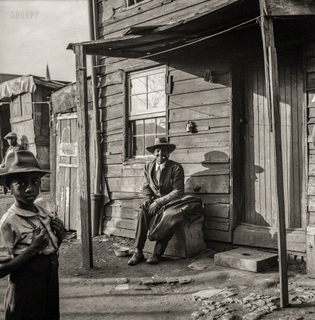 Photo showing: Zoot Alors -- July 1943. Washington, D.C. Negro alley dwellings near the Capitol.