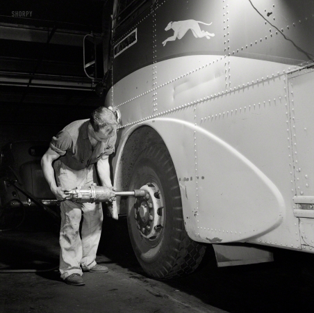 Photo showing: Greyhound Garage -- September 1943. Pittsburgh, Pennsylvania. Removing a tire from a bus at the Greyhound garage.