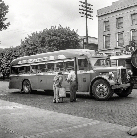 Photo showing: ColumBus -- September 1943. Washington Court House, Ohio. Passenger boarding Greyhound bus.