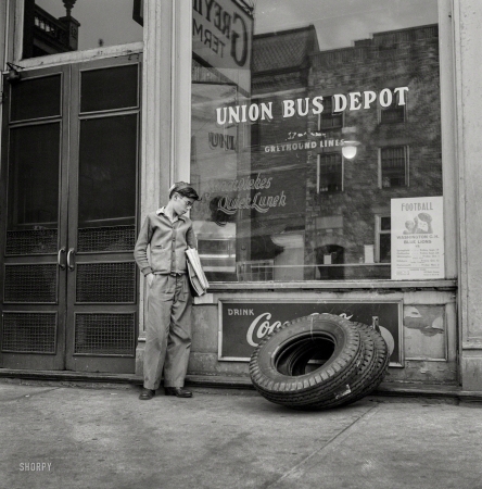 Photo showing: Bus Boy -- September 1943. Washington Court House, Ohio. Boy who rides to school daily on a Greyhound bus waiting outside the depot.