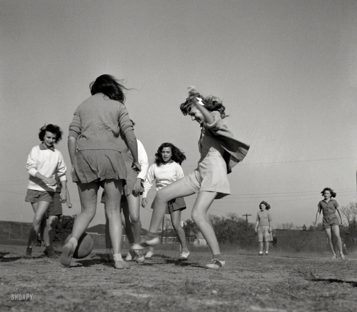 Photo showing: The P.E. Cup -- October 1943. Washington, D.C. Girls playing soccer in physical education class at Woodrow Wilson High School.