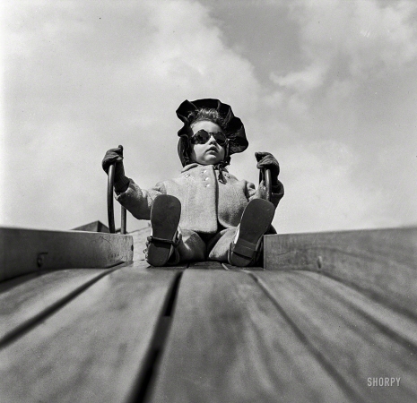 Photo showing: Downhill Slider -- March 1944. Children playing on the roof of the Lighthouse, an institution for the blind, at 111 East 59th Street, New York.