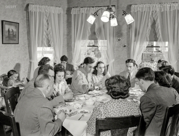 Photo showing: Sunday Dinner -- May 1942. Southington, Connecticut. The family of Ralph Hurlbut. A Sunday dinner
honoring Corporal Robert Hurlbut, twenty-one, home on his first furlough from the Army.