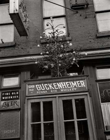 Photo showing: Good Old Guckenheimer -- December 1938. Philadelphia, Pennsylvania. Christmas tree over the door of a bar on Market Street.