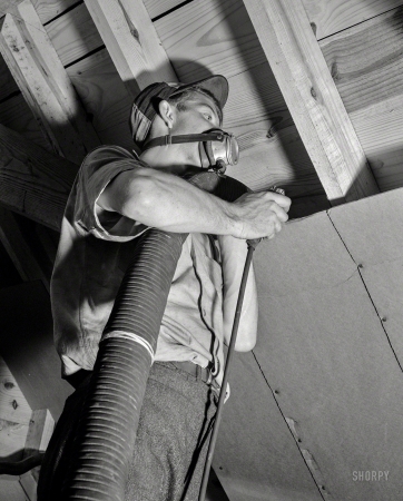 Photo showing: Blown In -- Washington, D.C., circa 1942. Conservation of fuel oil -- rock-wool attic insulation.