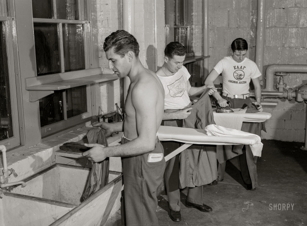 Photo showing: Iron Men -- December 1943. Washington, D.C. Servicemen using laundry facilities in the sub-basement of the United Nations service center.
