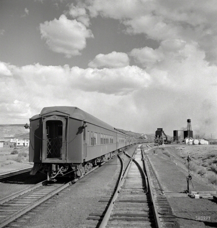 Photo showing: Troop Train -- March 1943. Grants, New Mexico. Passing a troop train stopping for coal and water between Belen and Gallup. 