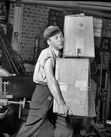 Photo showing: Worst Practices -- June 1942. The employee who carries in such a way as to obscure his
vision is not saving time -- he is endangering himself and his fellow workers.