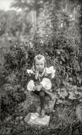 Photo showing: Tomato Tot -- A New England garden circa 1900 and yet another outlandishly attired tyke.