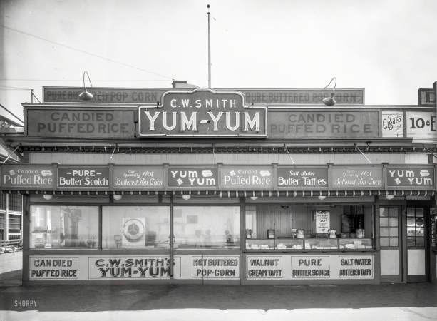 Photo showing: Hot and Buttered -- San Francisco circa 1930s. C.W. Smith's Yum-Yum candy concession along the Great Highway at Playland-at-the-Beach.